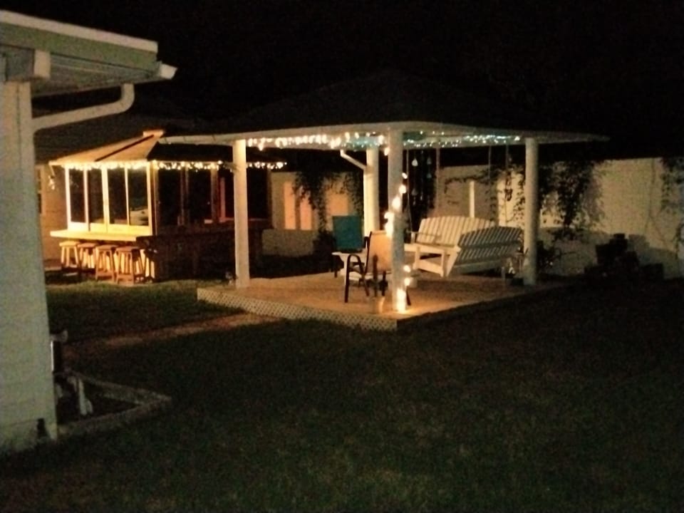 Our private backyard with covered hot tub and gazebo.