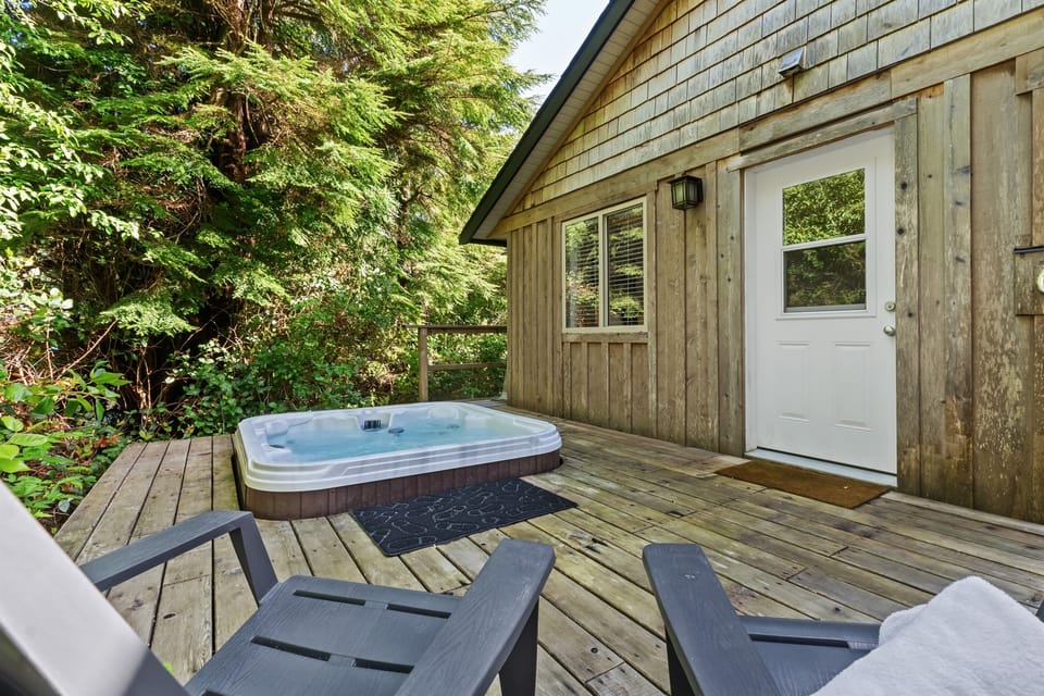 There is a private hot tub, outdoor shower, surfboard rack and seating for 2