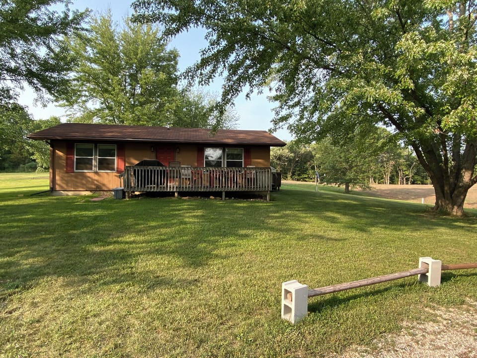 Front view of the house looking north. The house has a big yard.