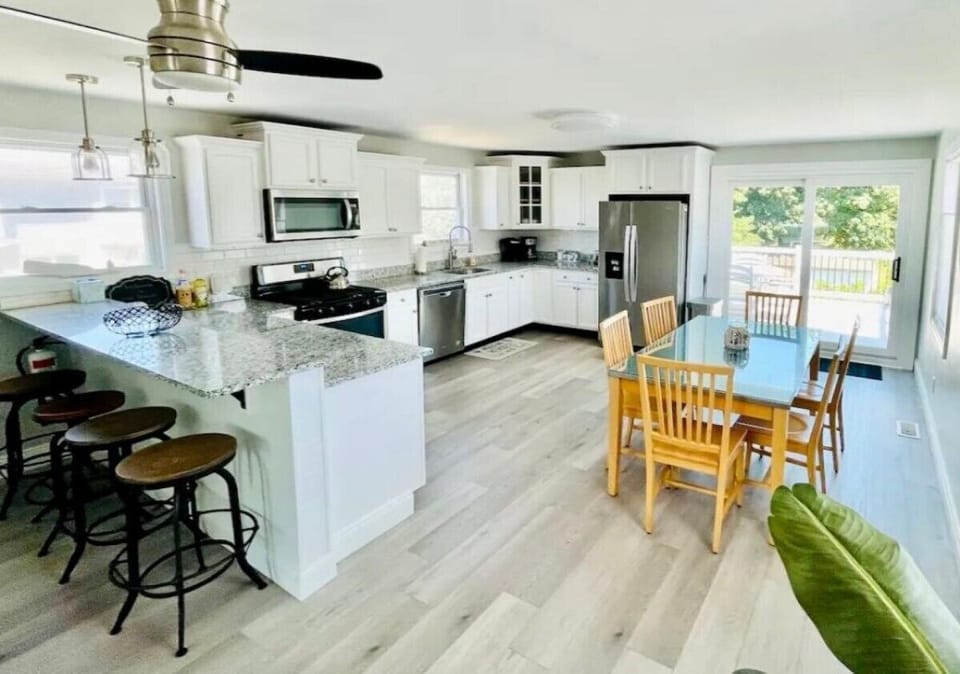 Large kitchen with walk out second story deck 