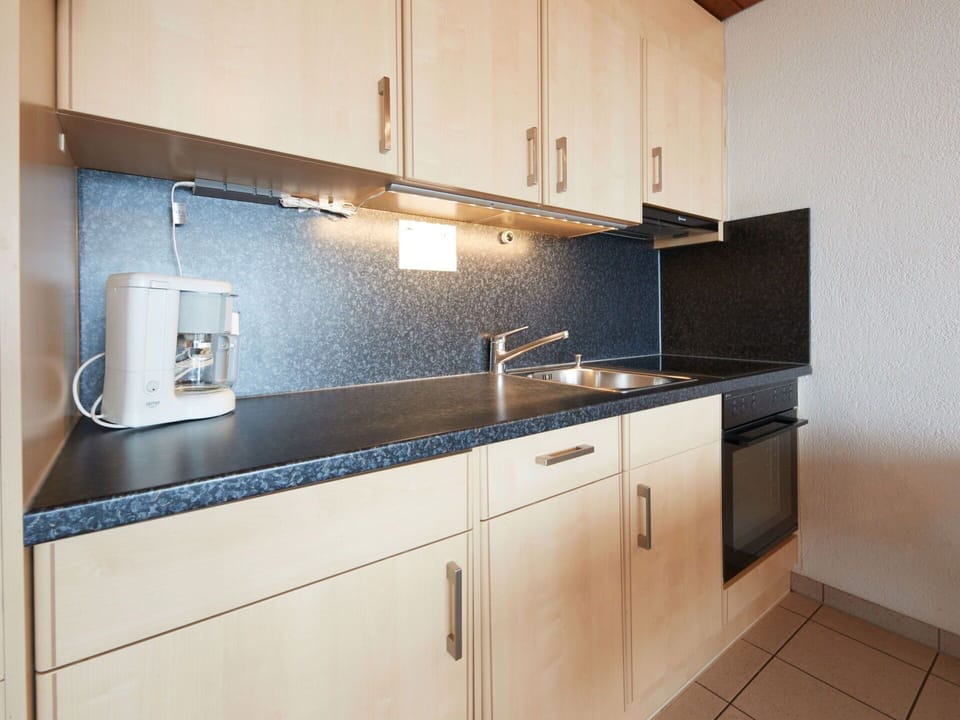 Tap, Kitchen Sink, Cabinetry, Sink, Countertop, Plumbing Fixture, Kitchen, Kitchen Stove, Kitchen Appliance, Wood
