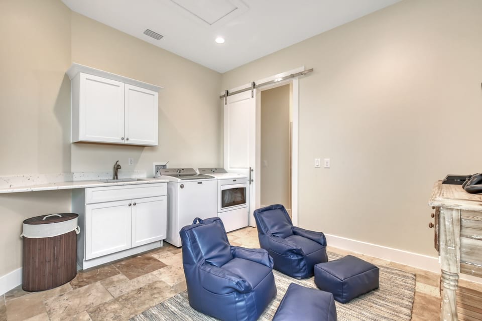 Washer, dryer and kid video game area 