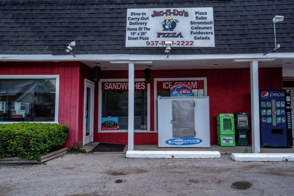 Right beside Jac N Do's Pizza, Sandwich, and Ice Cream Shop