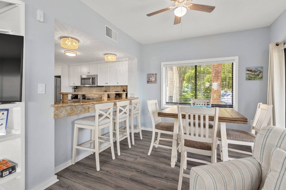 Plenty of table and counter space for 7 people.  Expand the table for more formal dining or games.