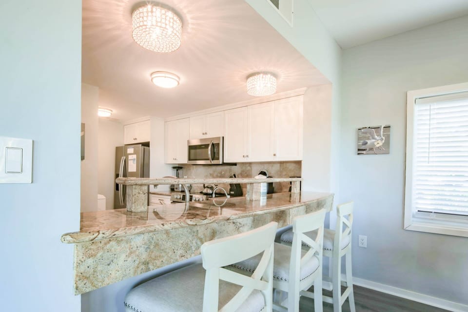 The kitchen looks out onto the dining area.