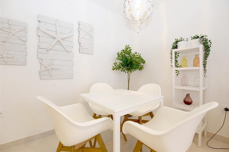 Modern dining area on a side of the lounge with space for four guests