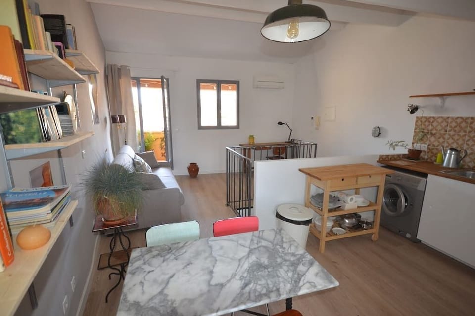 Fully equiped kitchen opening on the living room