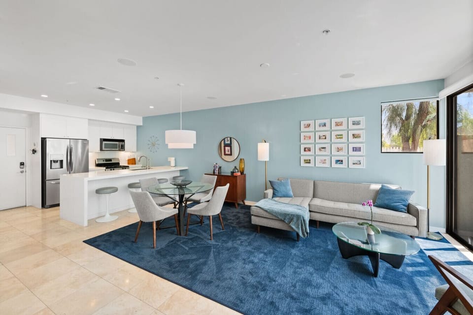 Bright and thoughtfully designed, featuring a cozy fireplace and plush sofa — perfect for relaxing after a day out.