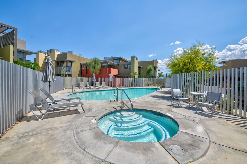Refreshing pool and hot tub, surrounded by modern architecture and bathed in sunshine, offer the perfect escape for relaxation and rejuvenation.