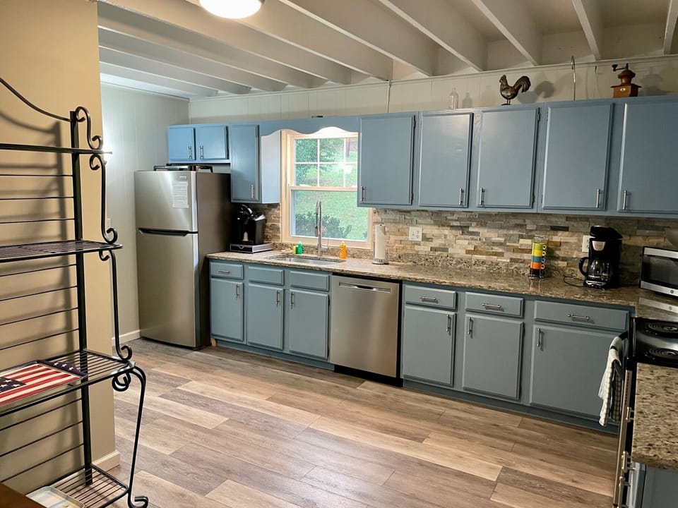 Kitchen has a regular coffee maker and a Keurig