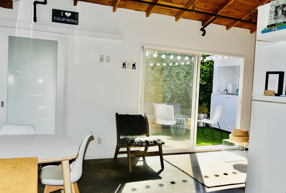 View from the kitchen. Bathroom to the left. Living room/outdoor area to the R.