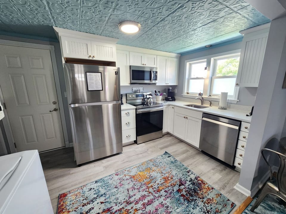 A fully equipped kitchen stocked with everything you need to cook and dine comfortably at home.