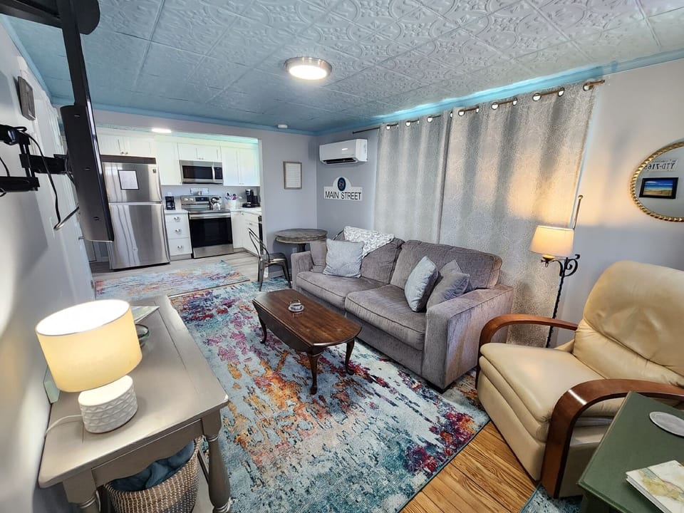 A charming eclectic living room with a queen sleeper sofa, offering flexible additional sleeping space.