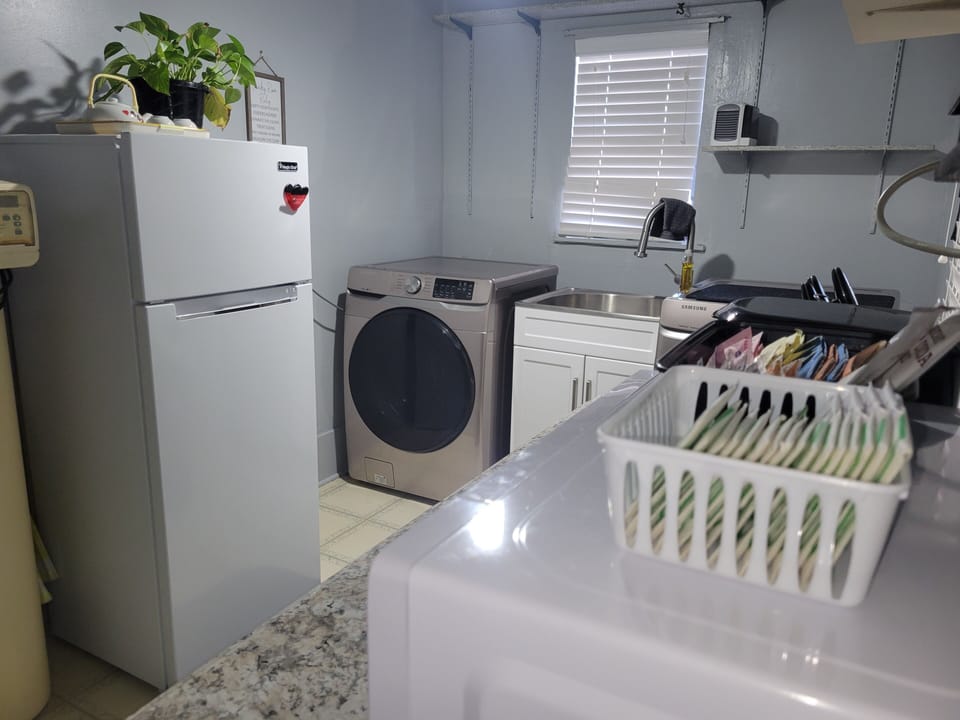 Fridge, kitchenette in laundry room, includes hot plate and all plates/utensils