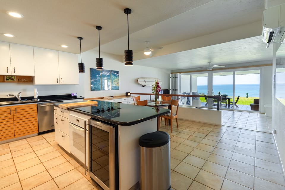 The kitchen and breakfast nook facing toward the living room and the ocean