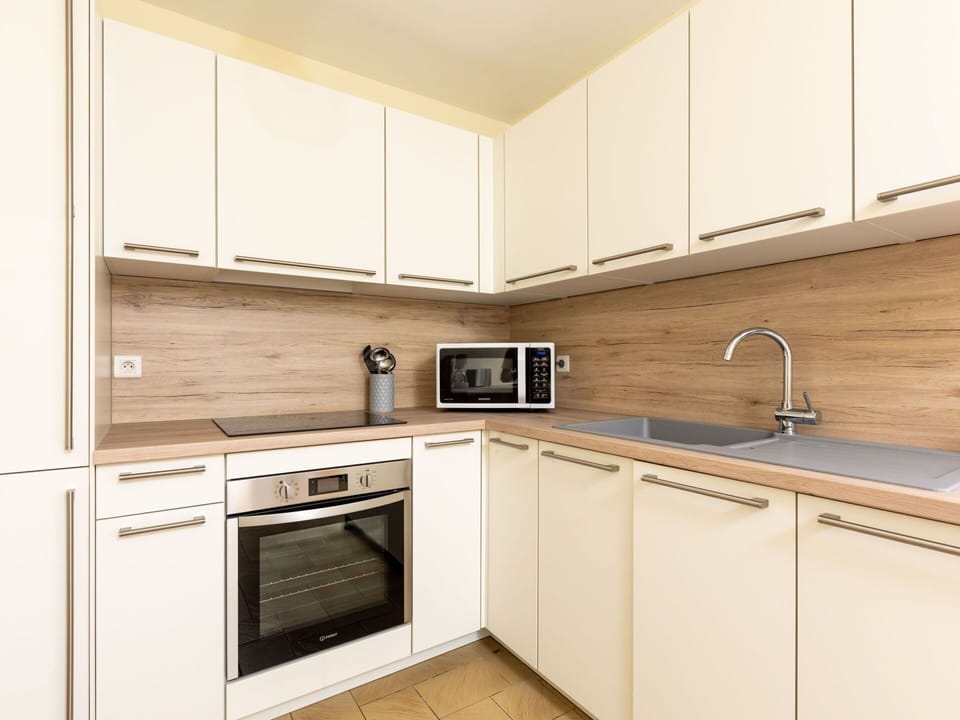 Kitchen, Countertop, Kitchen Appliance, Cabinetry, Flooring, Wood, Major Appliance, Interior Design, Floor, Home