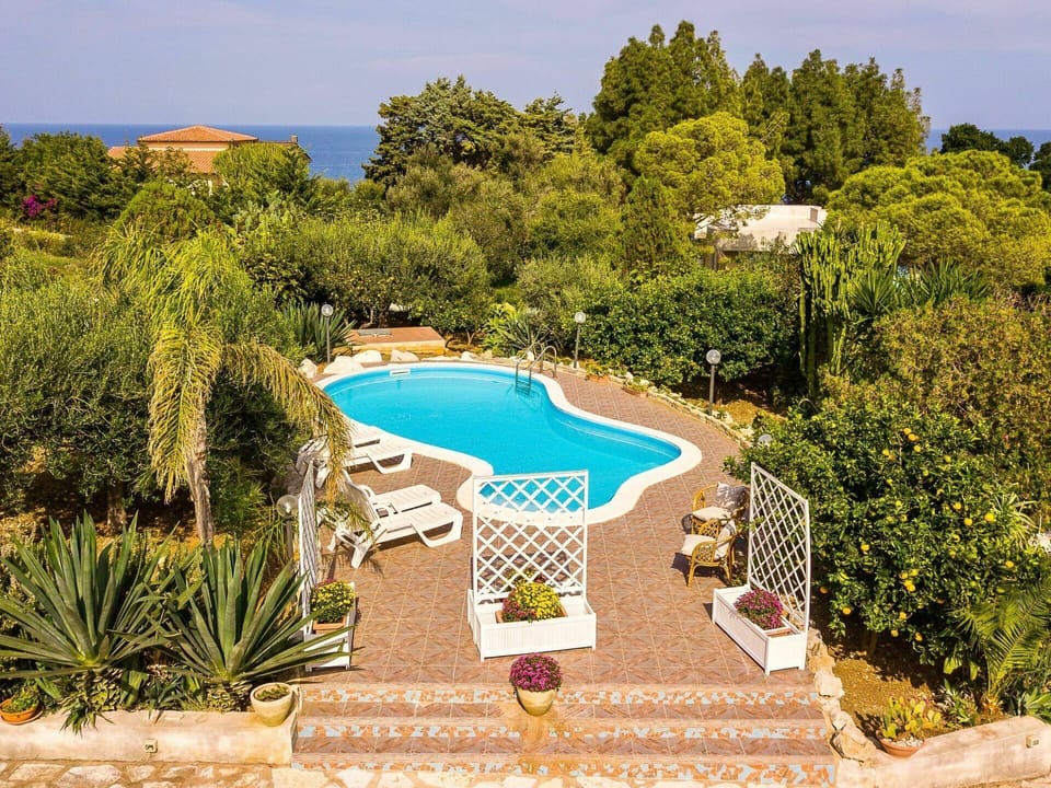 Plant, Sky, Water, Nature, Azure, Swimming Pool, Tree, Natural Landscape, Body Of Water, Vegetation