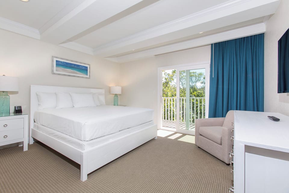 Stretch out on crisp linens and wake to peaceful greenery.