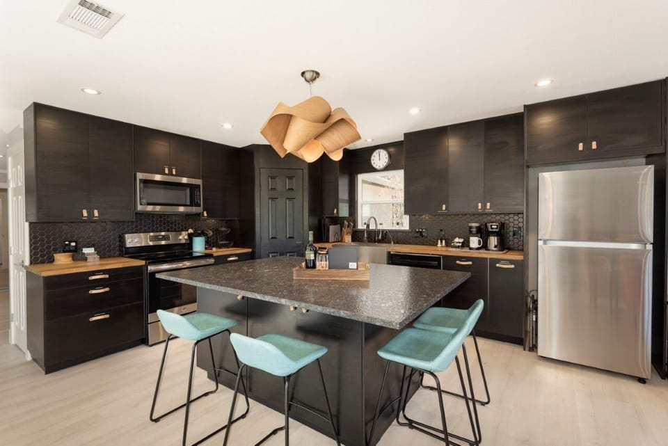 The large kitchen island is a favorite meeting spot.