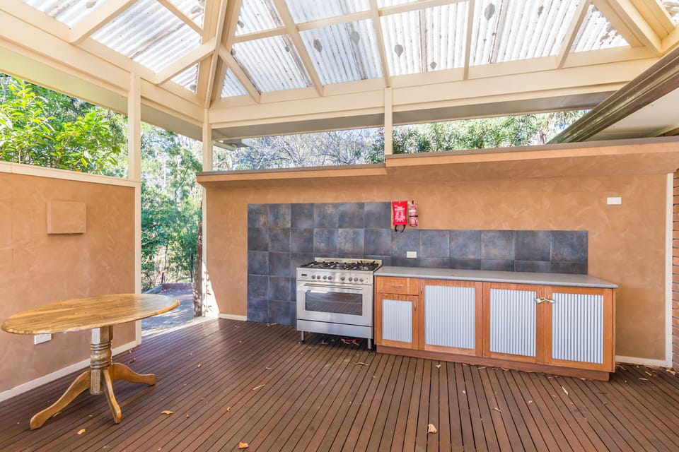 Outdoor cooking facilities: Grill and dine al fresco in our well-equipped outdoor kitchen.