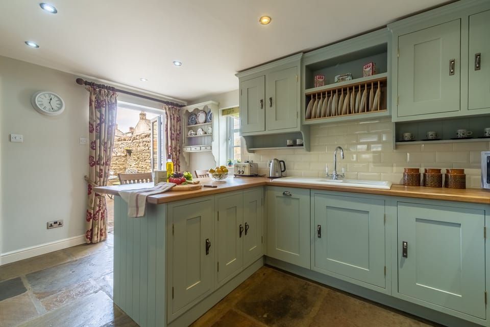 Ground floor: Spacious kitchen leading to courtyard