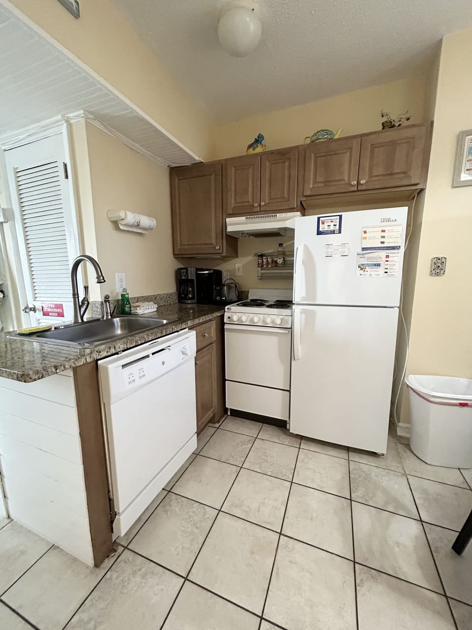 Full kitchen with dishwasher, stove, microwave and fridge