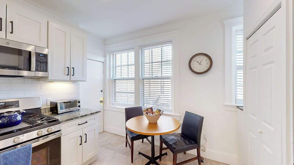 Washer and dryer located in the kitchen next to the fridge. 2 Seat table is right in front of this, great for breakfast. 