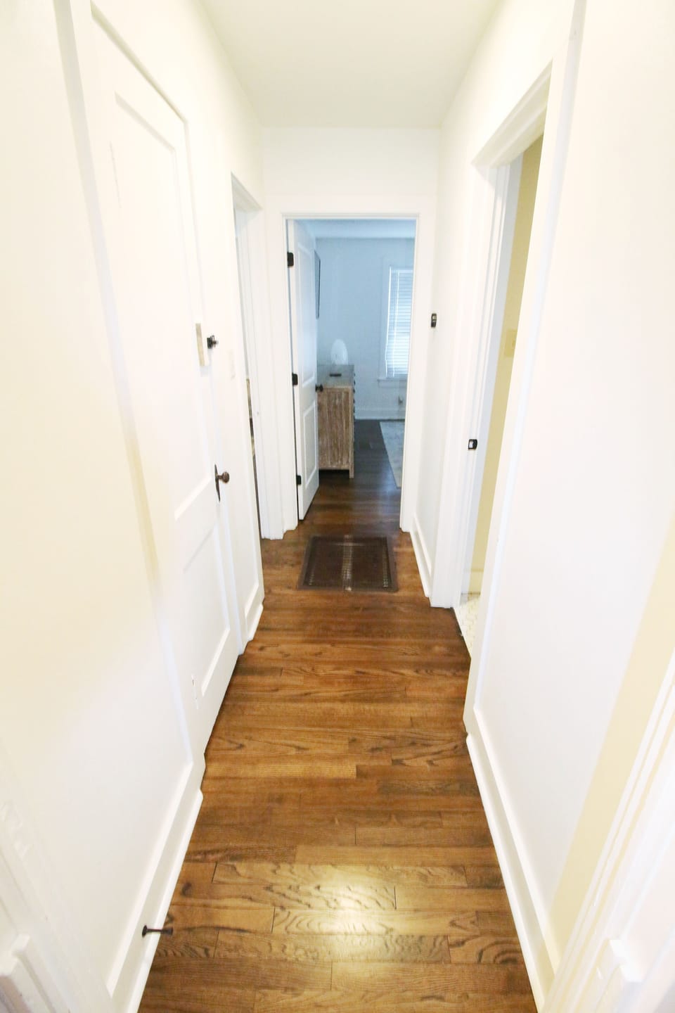 Downstairs hallway-bedroom straight ahead-bathroom to the right-living rm. left.