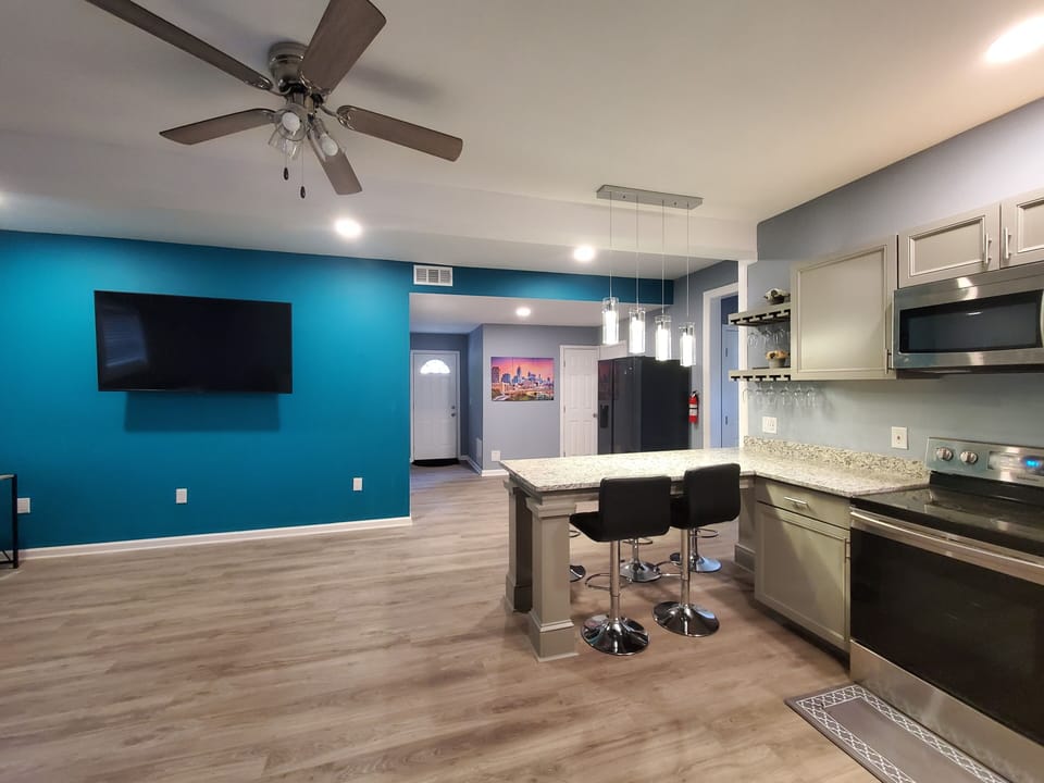 Modern eat-in kitchen with granite countertop & Bar stools (6); NEW appliances