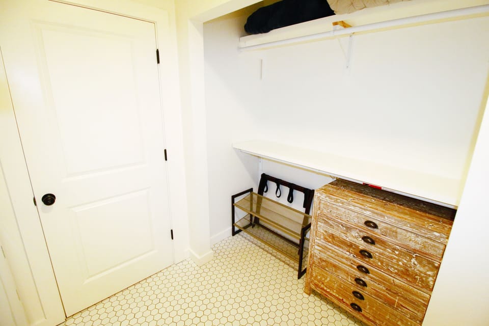 Shoe rack with chest of drawers.