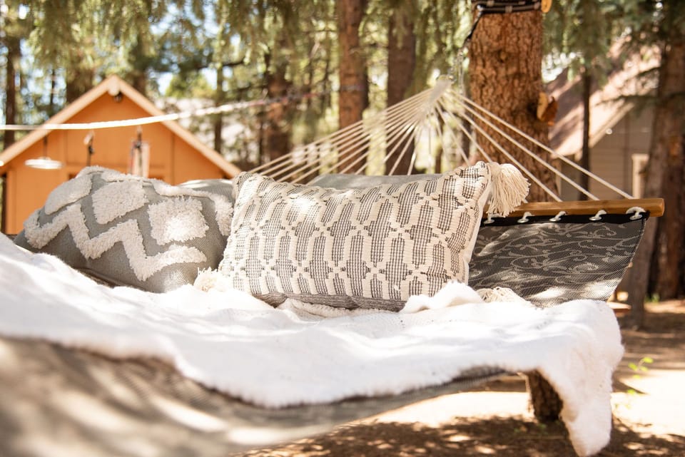 Swing on the large hammock under the shaded trees. (stored away in snow season)