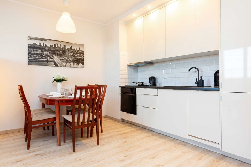 Kitchenette with oven and refrigerator. 