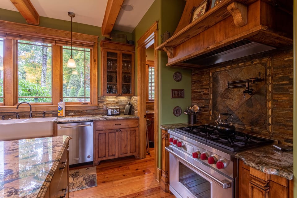 Fully stocked kitchen with gas range, double oven, dishwasher and walk in pantry.