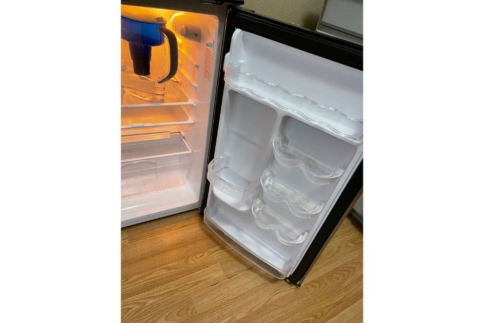 New fridge with freezer and new filtered water pitcher 
