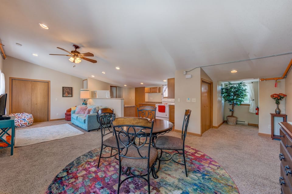 Enjoy the open-concept larger living room, with bonus kitchen and small dining area.