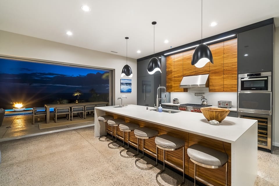 The oversized Subzero freezer and fridge, Kohler pro fixtures and Wolfe chef's appliances bring everyone together for baking and cooking