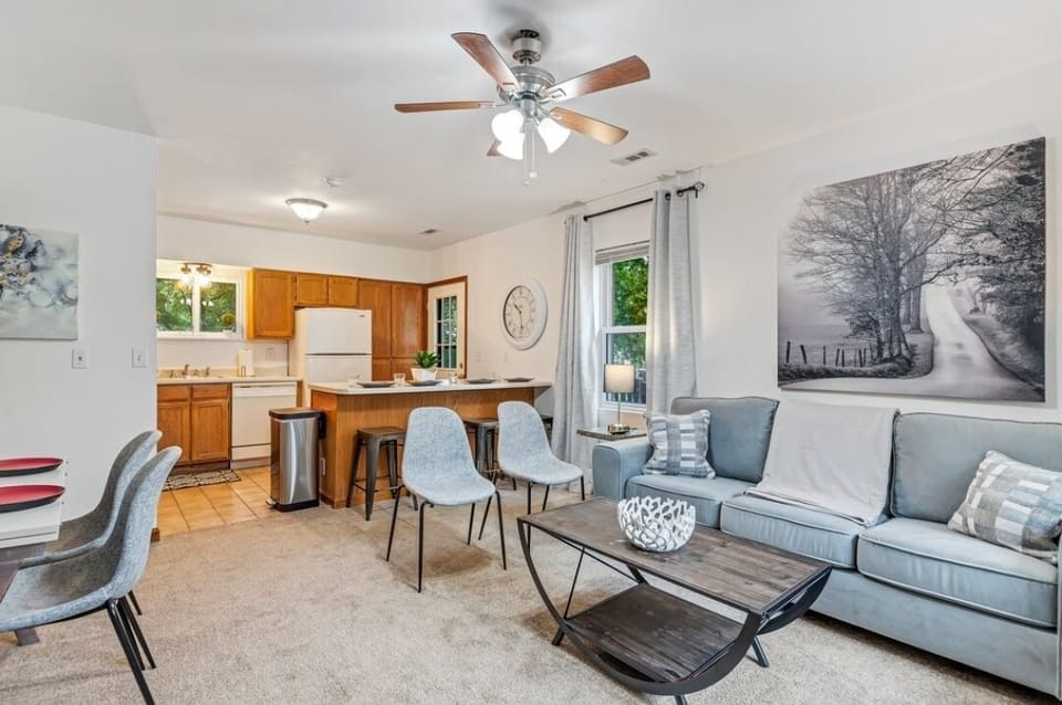 Back home living area with bar seating and addtl dining table or office area.