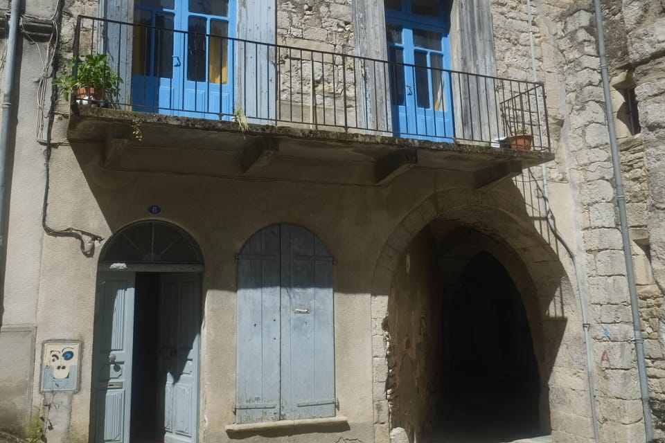 An exterior view of the balcony and kitchen.