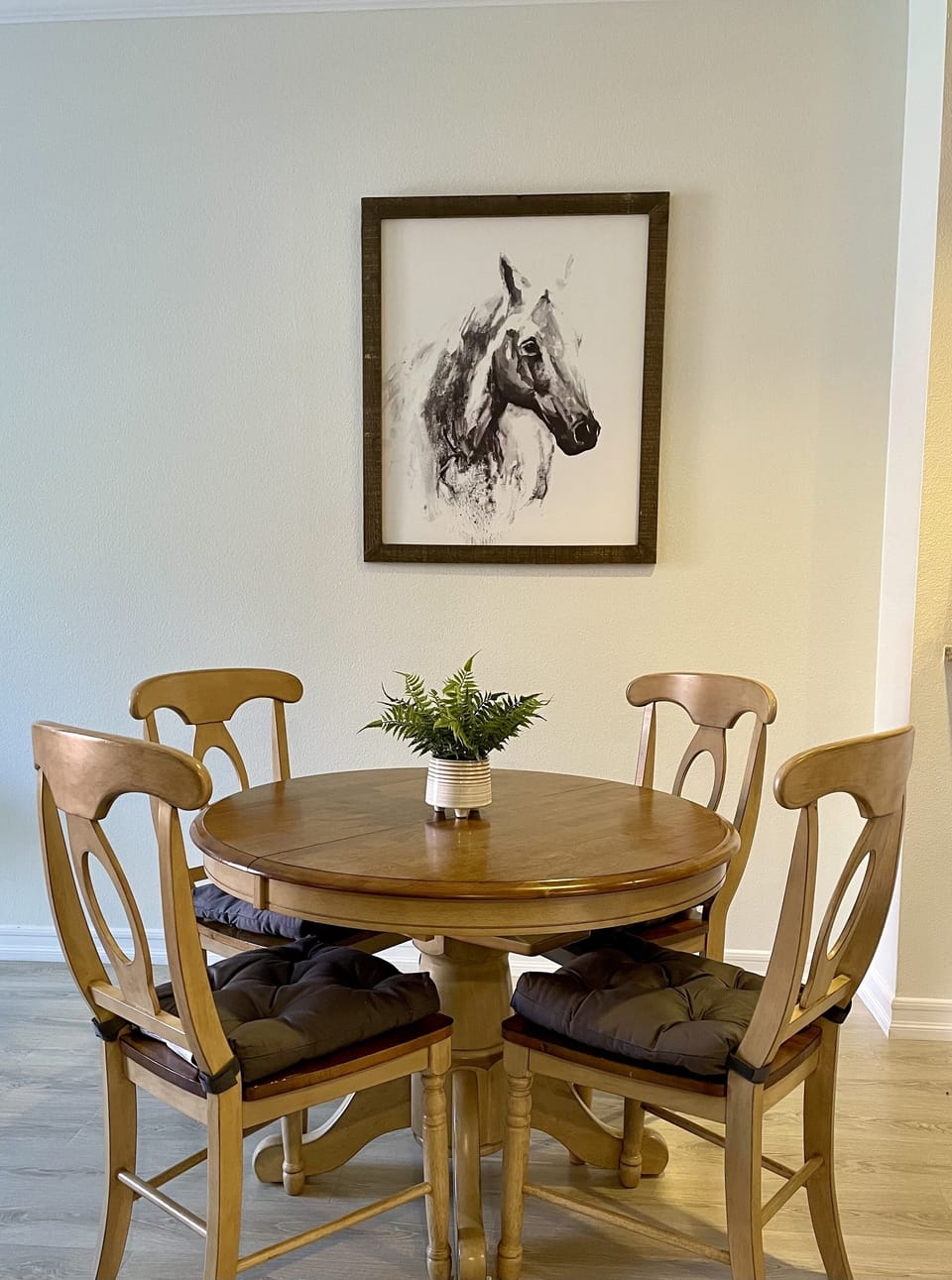 The 4-seater dining table can be easily extended to seat 6.