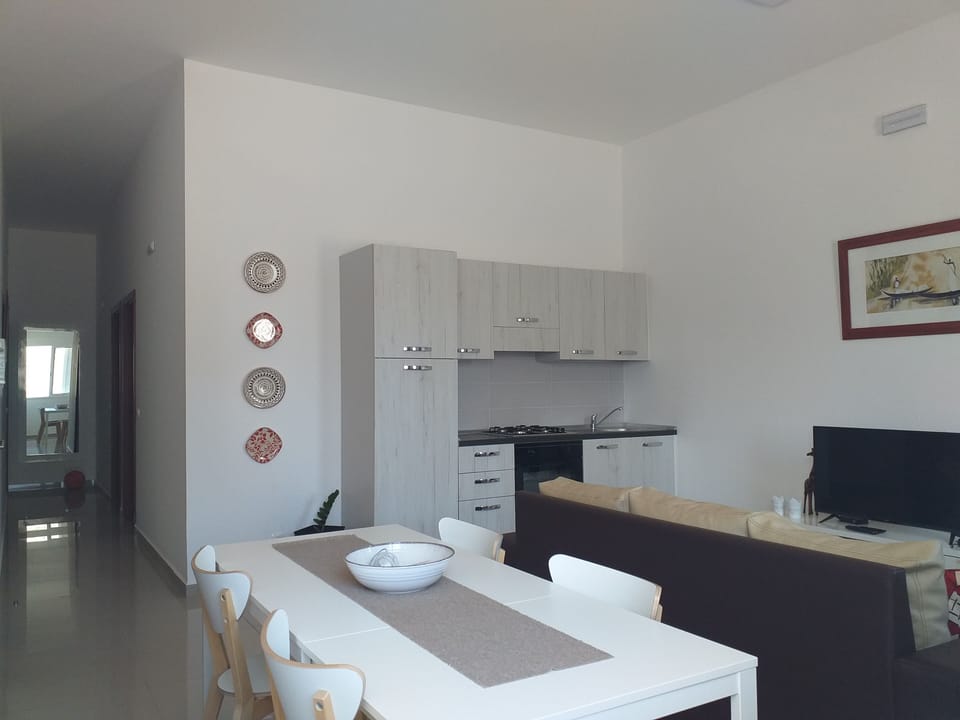 Living room with kitchen and dining corner