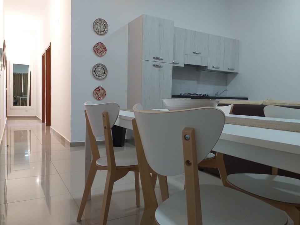 Living room with kitchen and dining corner
