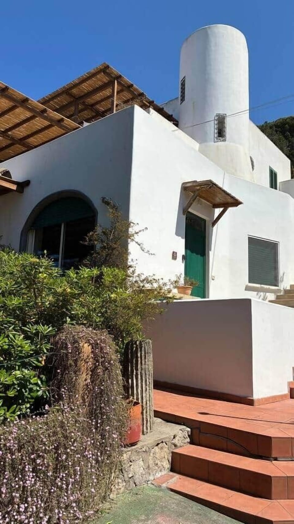 The Bougainville House exterior, nestled in the greenery of Torre Bianca in Gaeta.