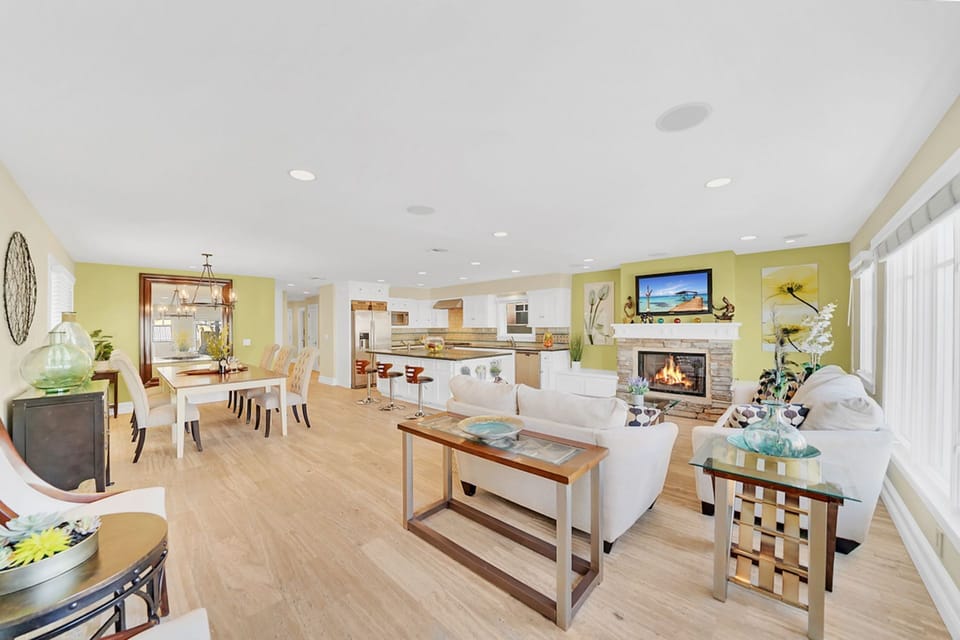 Families can comfortably spread out throughout all three levels of this vacation home that's just one house from the beach!
                
