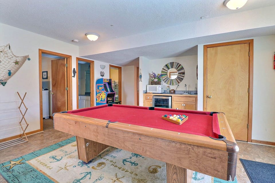 Head to Game Room with a Pool Table, Wet Bar, and Arcade Game System for even more fun during your stay!