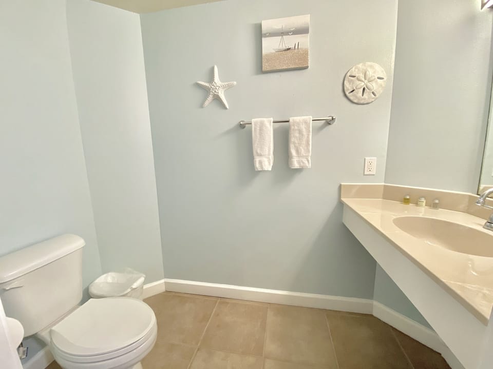 Half bath in hall next to bunk room
