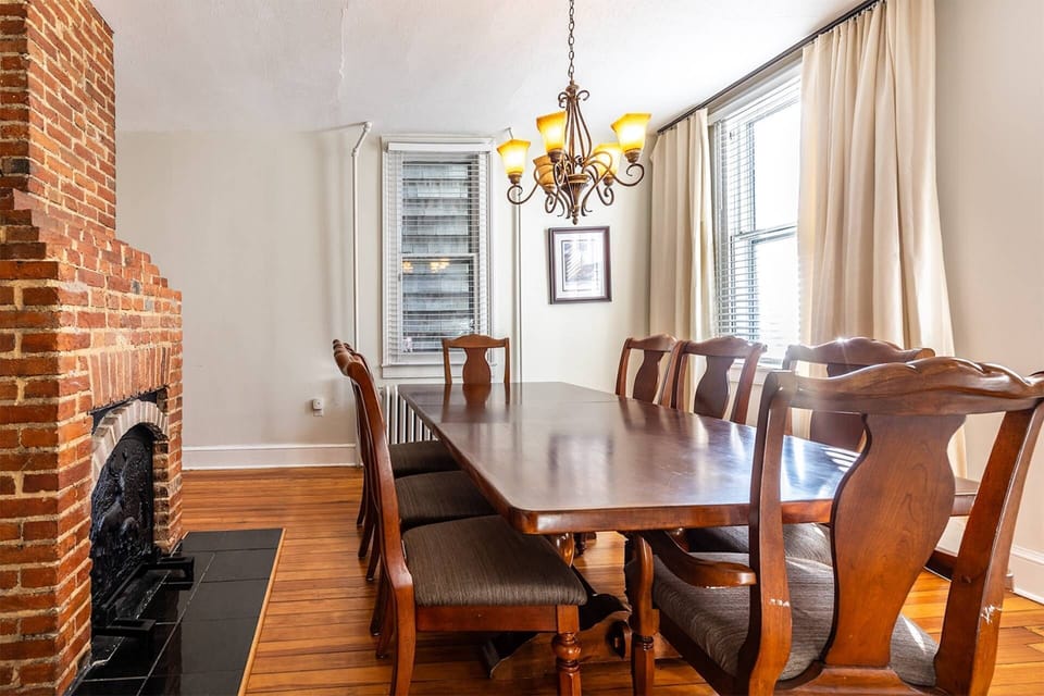 There are table protectors and linens provided for the spacious dining table.