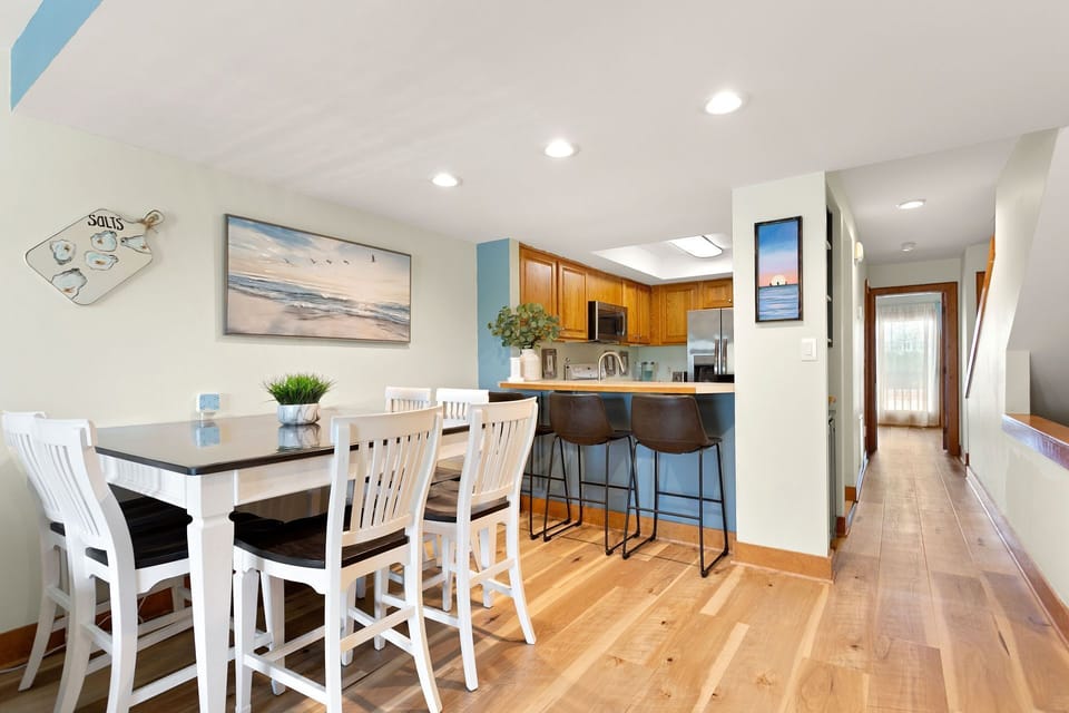 Spacious dining area with seating for six, perfect for family meals after a day in the sun.