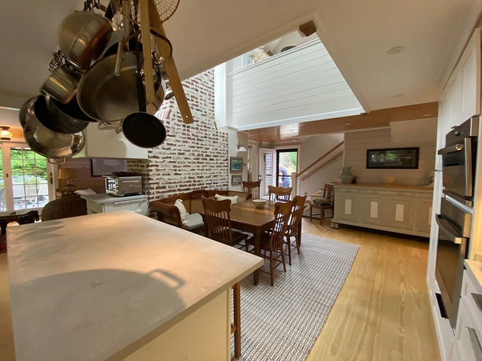 new kitchen with concrete counters and state of the art appliances 
