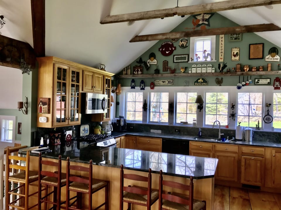 Kitchen with island and part of great room, dining room, mud room and pantry
