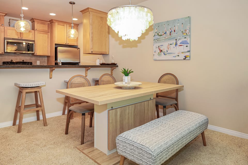 Dining area with plenty of seating for 6 and 3 at bar